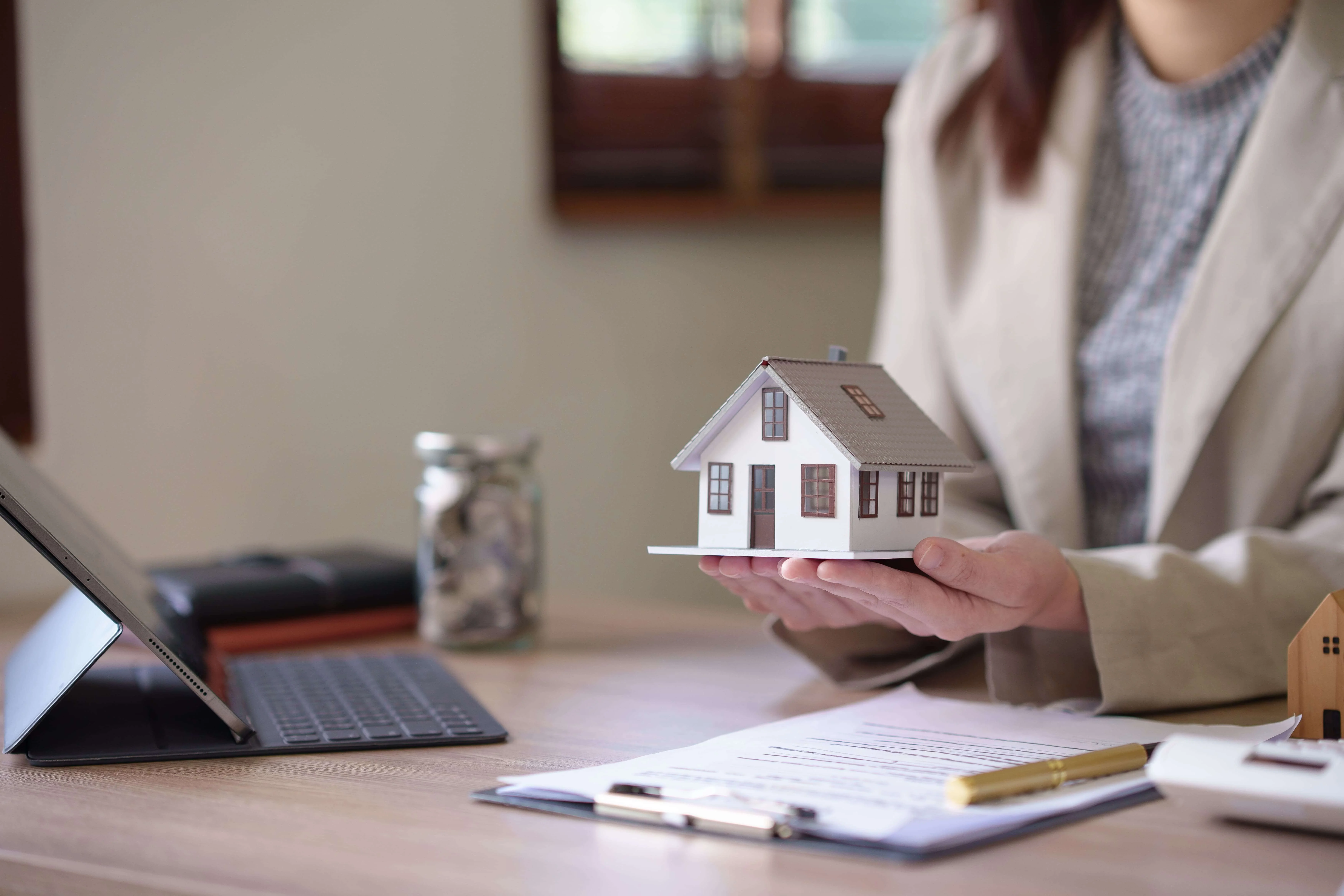 An illustrative depiction of a legal document and pen, symbolizing loan document preparation. This complements Defiant Law Group's description as a specialized firm in Real Estate Transaction Law, emphasizing their services in preparing, reviewing, and advising on loan documents. It represents their meticulous attention to detail, compliance with real estate and lending laws, and commitment to safeguarding clients' interests in real estate transactions involving loans.